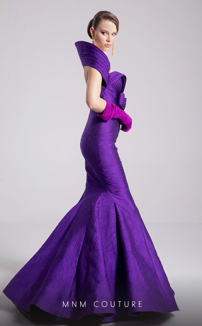 MNM Couture Style F02901 dress showcasing a pleated sweetheart neckline, mid-bow detail, and a stunning mermaid silhouette. / Couture Shop LA