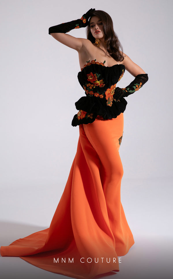 MNM Couture F02902 strapless gown with black embroidered velvet corset top, vibrant orange floor-length skirt, and matching gloves. | Couture Shop LA