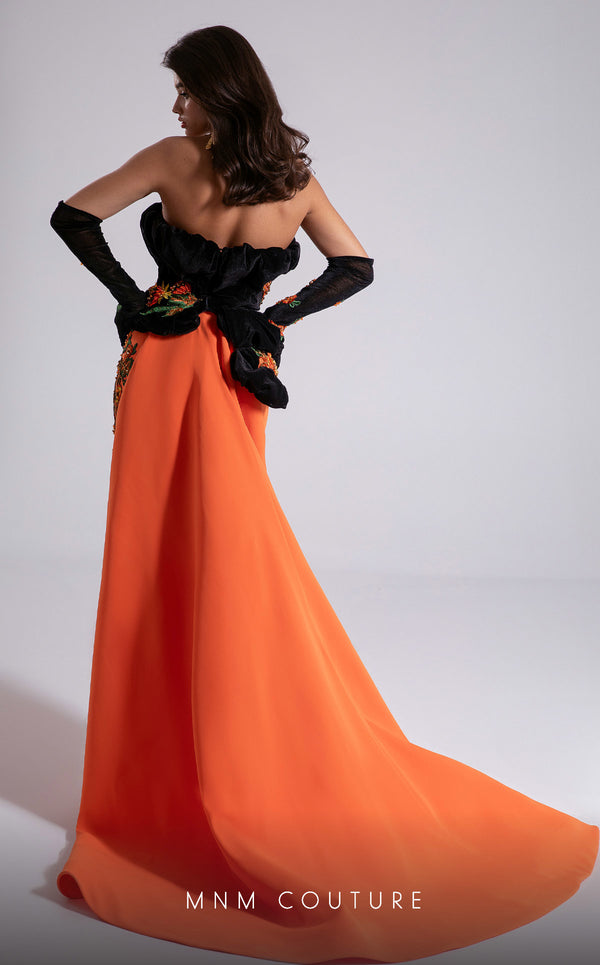 MNM Couture F02902 strapless gown with black embroidered velvet corset top, vibrant orange floor-length skirt, and matching gloves. | Couture Shop LA