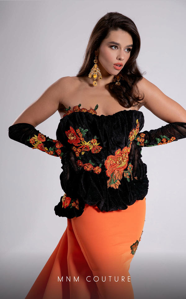 MNM Couture F02902 strapless gown with black embroidered velvet corset top, vibrant orange floor-length skirt, and matching gloves. | Couture Shop LA