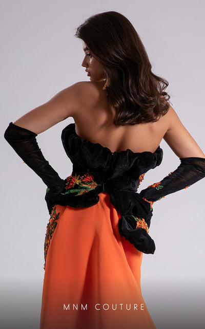MNM Couture F02902 strapless gown with black embroidered velvet corset top, vibrant orange floor-length skirt, and matching gloves. | Couture Shop LA