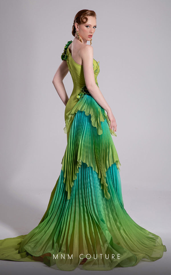 MNM Couture Style F02911 one-shoulder green gown with a draped bodice, floral appliqués at shoulder and hip, and a large pleated ombre ruffle train. | Couture Shop LA