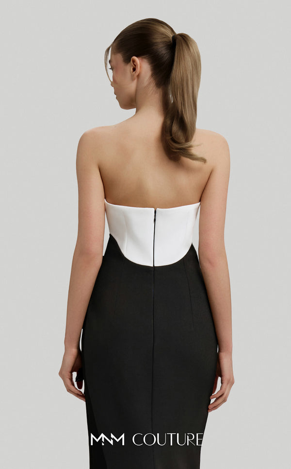 MNM Couture Style F02917 showing a fitted green column gown with a pink strapless bustier top, adorned with embroidered floral appliqués, and paired with a matching green cape. | Couture Shop LA