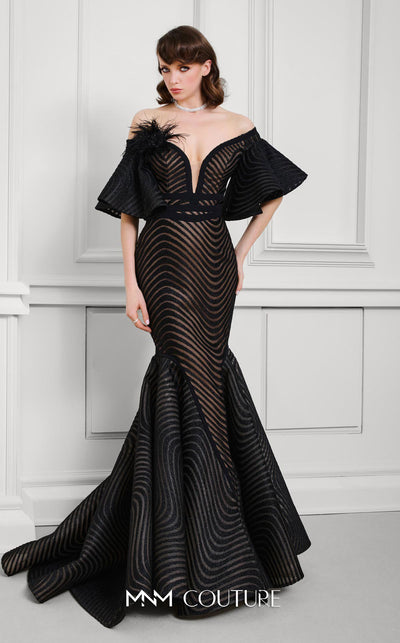 MNM Couture Style F02925 - Elegant black mesh mermaid gown featuring off-shoulder ruffled bell sleeves, a deep V-neckline, and a plumage brooch. | Couture Shop LA
