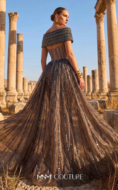 MNM Couture Style F02929 showcasing a dramatic off-the-shoulder A-line gown with dark sequin and bead embellishments and a full, vertically striped tulle overlay. | Couture Shop LA