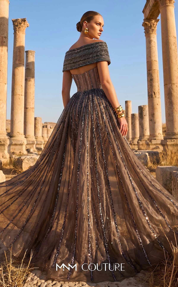 MNM Couture Style F02929 showcasing a dramatic off-the-shoulder A-line gown with dark sequin and bead embellishments and a full, vertically striped tulle overlay. | Couture Shop LA