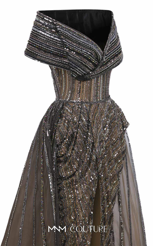 MNM Couture Style F02929 showcasing a dramatic off-the-shoulder A-line gown with dark sequin and bead embellishments and a full, vertically striped tulle overlay. | Couture Shop LA