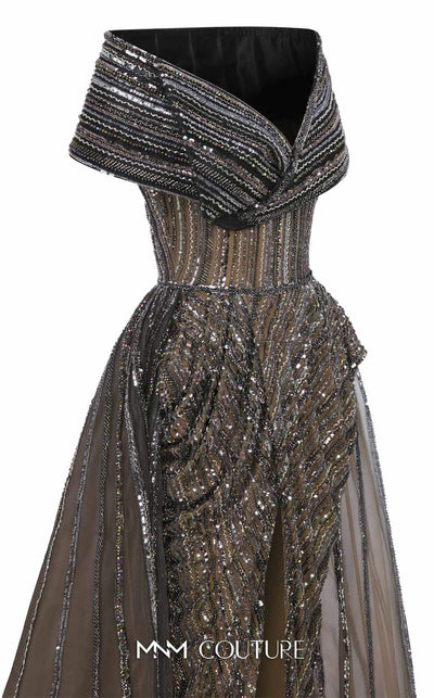 MNM Couture Style F02929 showcasing a dramatic off-the-shoulder A-line gown with dark sequin and bead embellishments and a full, vertically striped tulle overlay. | Couture Shop LA
