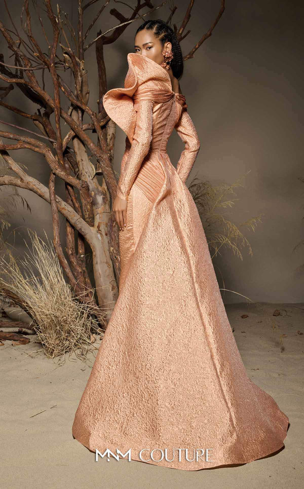 MNM Couture F02982 textured jacquard gown with off-the-shoulder long sleeves, pleated fans on the left shoulder, and a dramatic back train.|Couture Shop LA