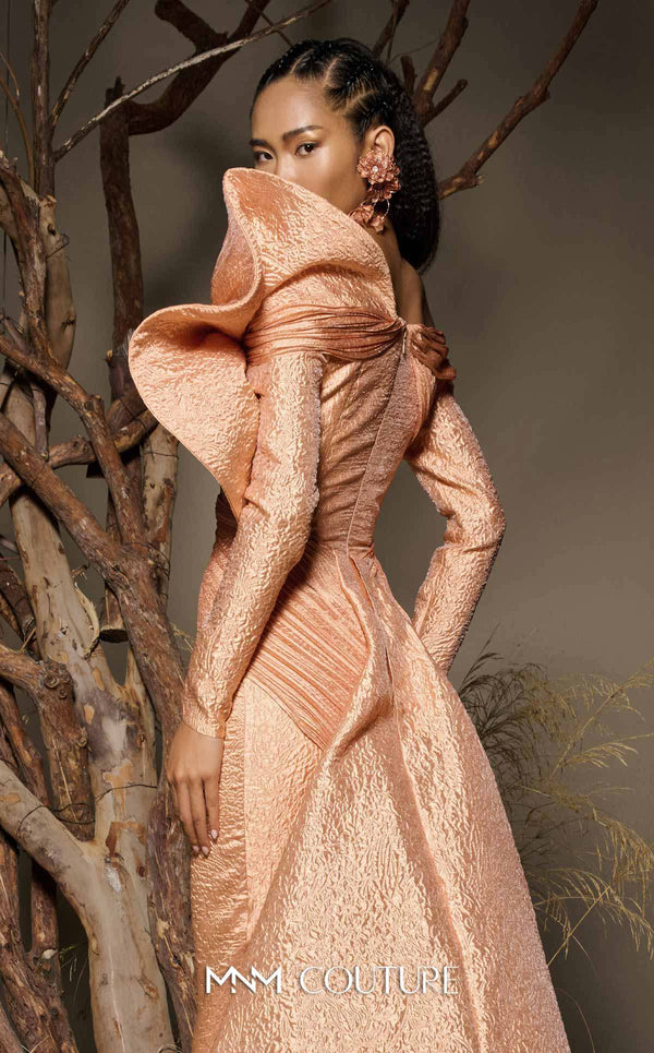 MNM Couture F02982 textured jacquard gown with off-the-shoulder long sleeves, pleated fans on the left shoulder, and a dramatic back train.|Couture Shop LA