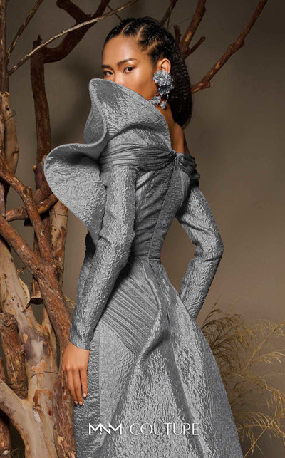 MNM Couture F02982 textured jacquard gown with off-the-shoulder long sleeves, pleated fans on the left shoulder, and a dramatic back train.|Couture Shop LA