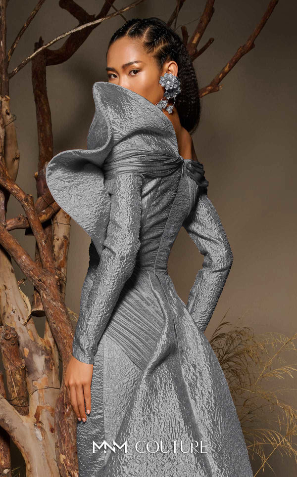 MNM Couture F02982 textured jacquard gown with off-the-shoulder long sleeves, pleated fans on the left shoulder, and a dramatic back train.|Couture Shop LA