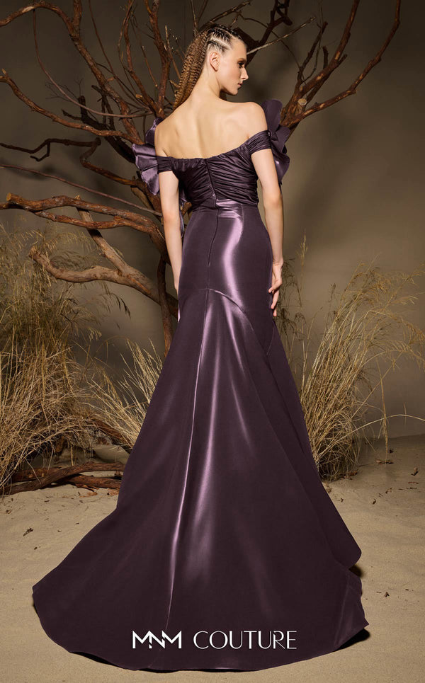 MNM Couture F02993 metallic satin mermaid gown with off-the-shoulder design, floral accents on the shoulders, and a dramatic train.|Couture Shop LA