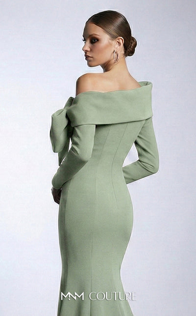 MNM Couture F03007 mint crepe long-sleeve mermaid gown with asymmetric large folded boat neckline, bare left shoulder, and oversized flat sculptural bow at the bust | Couture Shop LA
