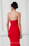 Stunning red rayon crepe gown with an asymmetric neckline, intricate bead embroidery, peplum detail, and long train. | Couture Shop LA