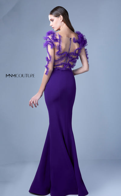 A glamorous MNM Couture G1094 mermaid gown featuring sheer sleeves, ruched bodice, illusion back, and sparkling accents for high-impact style. | Couture Shop LA