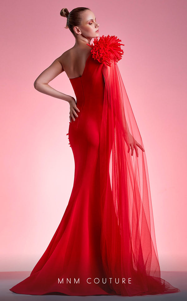 MNM Couture G1211 one-shoulder gown with puffball details, sheer flowing sleeve, and mermaid skirt. | Couture Shop LA