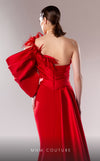 MNM Couture G1629 dress showcasing the dramatic silhouette and striking feather embellishments. | Couture Shop LA
