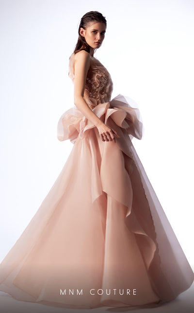 MNM Couture G1723 gown showcasing the stunning lace details and dramatic skirt. | Couture Shop LA