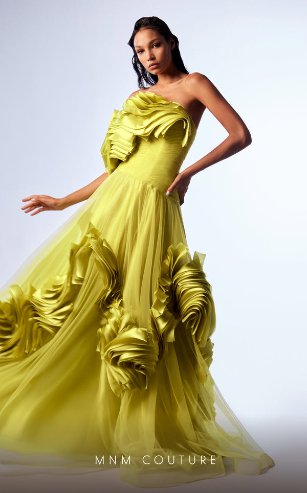 Green organza A-line evening gown with satin ruffles, structured corset bodice, and one off-the-shoulder sleeve highlighting MNM Couture Style G1736 | Couture Shop LA.