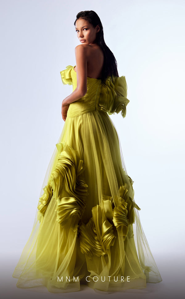 Green organza A-line evening gown with satin ruffles, structured corset bodice, and one off-the-shoulder sleeve highlighting MNM Couture Style G1736 | Couture Shop LA.