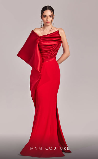 MNM Couture G1803 gown featuring a sleek mermaid silhouette, organza draping, and an exaggerated one-shoulder sleeve. | Couture Shop LA