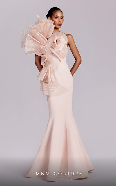 MNM Couture G1827 gown showcasing the fitted silhouette and dramatic ruffles on the shoulder. | Couture Shop LA