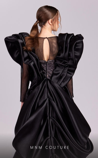 MNM Couture G1835 gown showcasing the dramatic ruffled shoulders and thigh-high slit. | Couture Shop LA