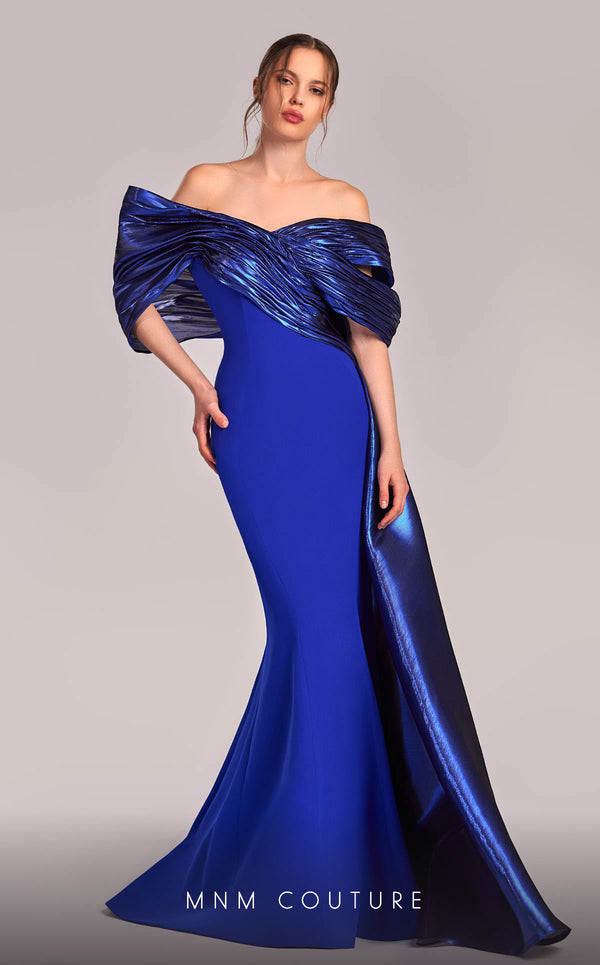 MNM Couture G1840 gown showcasing the elegant off-shoulder design and graceful mermaid skirt. | Couture Shop LA