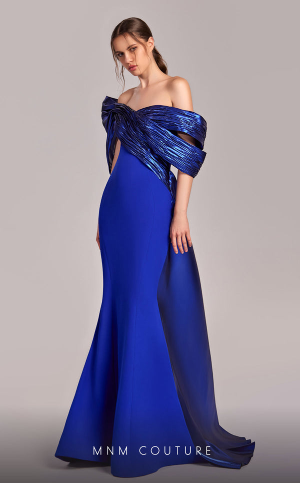 MNM Couture G1840 gown showcasing the elegant off-shoulder design and graceful mermaid skirt. | Couture Shop LA