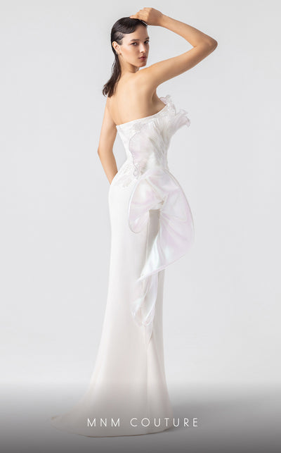 MNM Couture G1903 pearly off-white holographic gown with cascading peplum and high-slit detailing. | Couture Shop LA