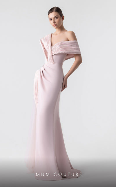 MNM Couture G1929 pink gown with asymmetrical pleats and flowing fabric for an elegant and timeless look. | Couture Shop LA
