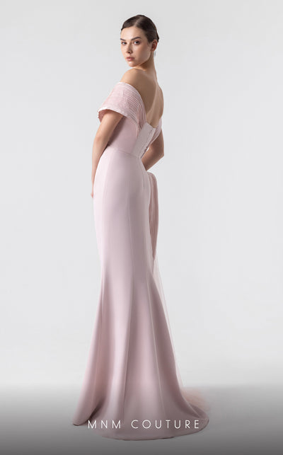 MNM Couture G1929 pink gown with asymmetrical pleats and flowing fabric for an elegant and timeless look. | Couture Shop LA
