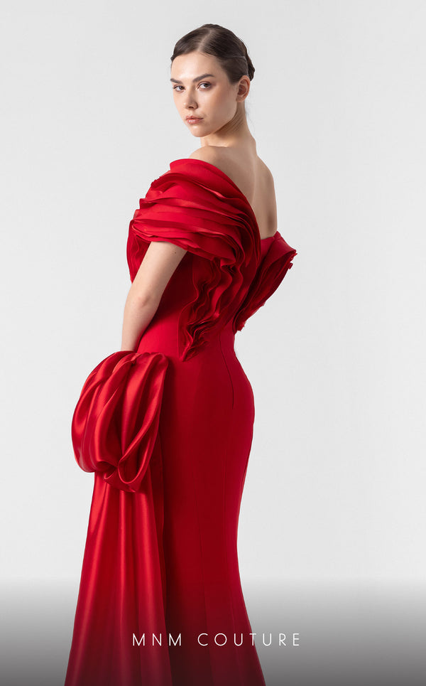 MNM Couture G1942 scarlet red gown with off-shoulder elegance and a bold organza side train. | Couture Shop LA
