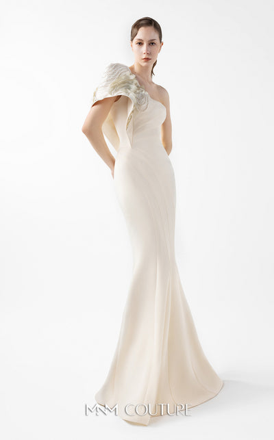MNM Couture Style G2003 showcasing a cream one-shoulder mermaid gown with sculptural organza manipulation and cascading pearl embroidery on the shoulder. | Couture Shop LA
