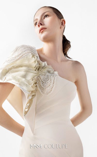 MNM Couture Style G2003 showcasing a cream one-shoulder mermaid gown with sculptural organza manipulation and cascading pearl embroidery on the shoulder. | Couture Shop LA