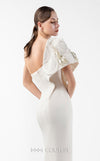 MNM Couture Style G2003 showcasing a cream one-shoulder mermaid gown with sculptural organza manipulation and cascading pearl embroidery on the shoulder. | Couture Shop LA