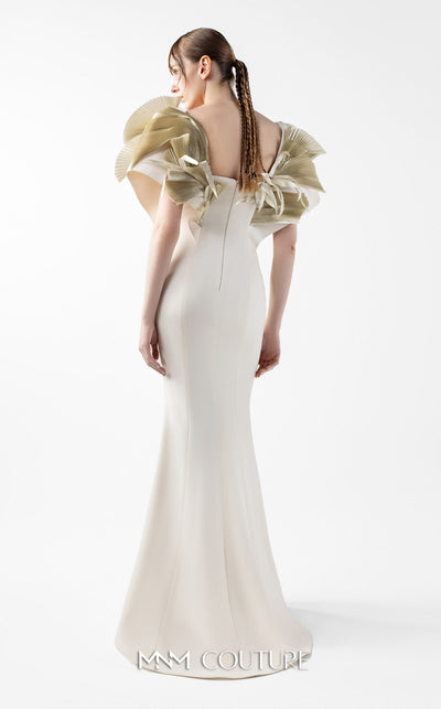 MNM Couture Style G2005 showcasing a cream mermaid gown with architectural golden pleated organza shoulder detailing resembling sculptural wings and ethereal fan accents | Couture Shop LA