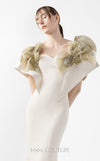 MNM Couture Style G2005 showcasing a cream mermaid gown with architectural golden pleated organza shoulder detailing resembling sculptural wings and ethereal fan accents | Couture Shop LA