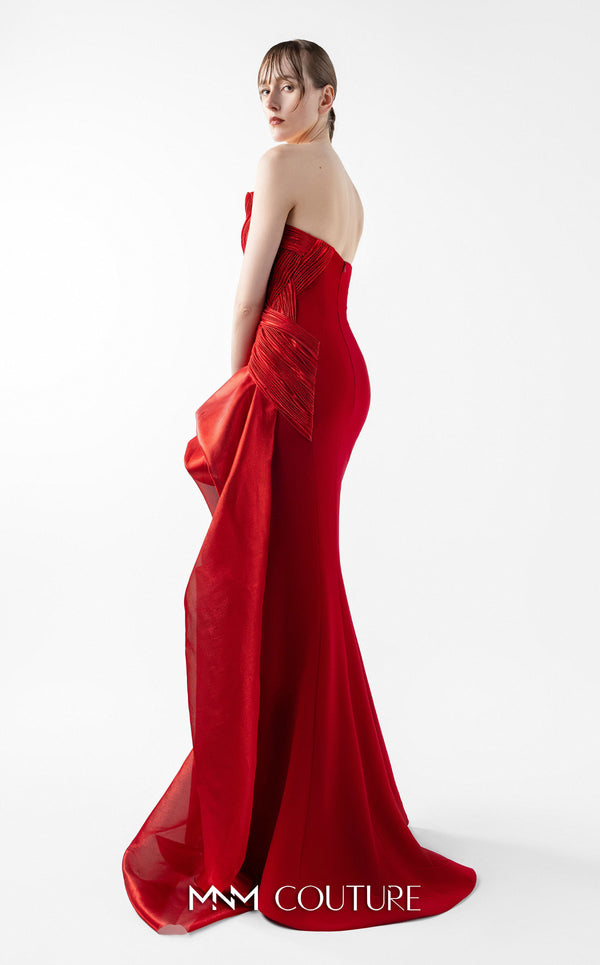 MNM Couture Style G2006 showcasing a strapless red gown with intricately pleated entwined bodice and dramatic asymmetrical organza bloom cascading from one side | Couture Shop LA