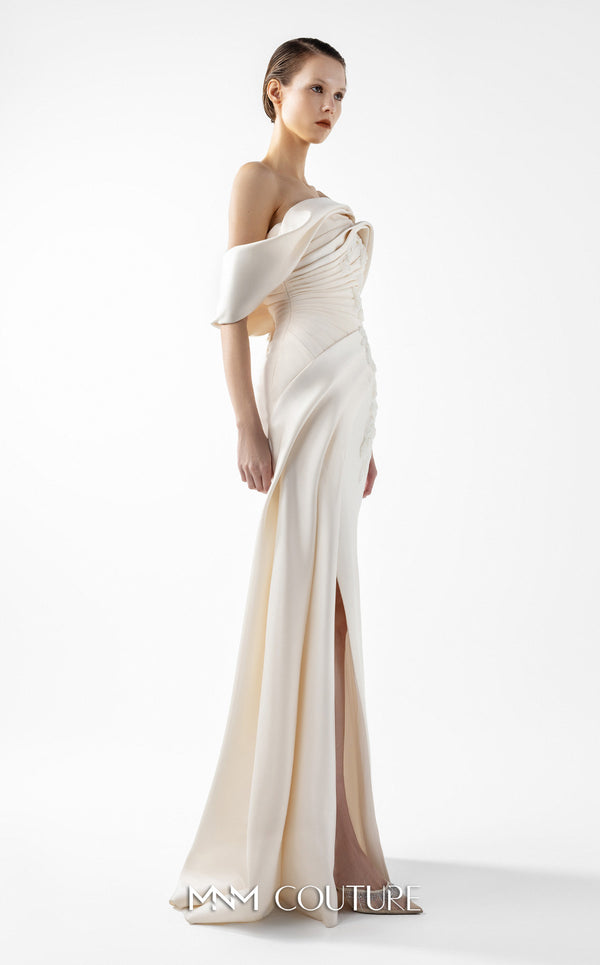 MNM Couture Style G2007 showcasing a cream crepe gown with dramatic off-shoulder satin sleeves, exquisite handmade embroidery on the bodice, and subtle thigh-high slit | Couture Shop LA