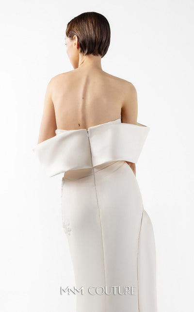 MNM Couture Style G2007 showcasing a cream crepe gown with dramatic off-shoulder satin sleeves, exquisite handmade embroidery on the bodice, and subtle thigh-high slit | Couture Shop LA