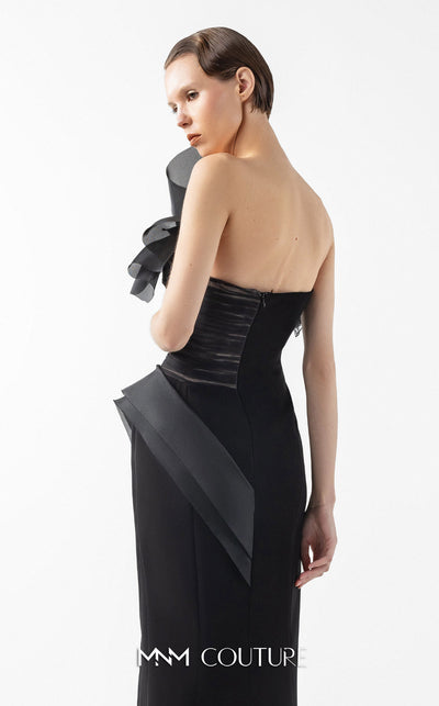 MNM Couture Style G2010 showcasing a black crepe gown with a sculpted bust of organza, Chantilly lace, draped tulle, and a daring high front slit. | Couture Shop LA