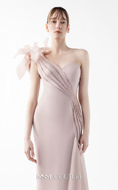 MNM Couture Style G2026 showcasing a blush crepe gown with organza floral accent, lace embellishments, and a side train | Couture Shop LA