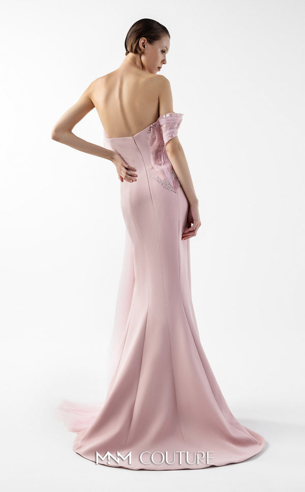 MNM Couture Style G2031 showcasing a pink mermaid gown with an embellished off-shoulder, intricate lace detailing, an alluring open slit, and a delicate tulle train | Couture Shop LA