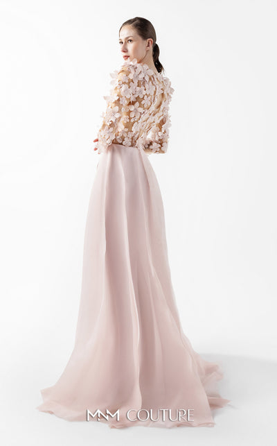 MNM Couture Style G2035 showcasing a blush pink gown with sheer illusion bodice, long sleeves adorned with 3D floral appliques, lace inserts, and flowing envelope skirt | Couture Shop LA