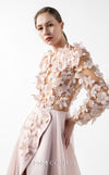 MNM Couture Style G2035 showcasing a blush pink gown with sheer illusion bodice, long sleeves adorned with 3D floral appliques, lace inserts, and flowing envelope skirt | Couture Shop LA
