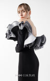 MNM Couture Style G2036 showcasing a black off-shoulder mermaid gown with long sleeves and voluminous, sculptural organza ruffles in silver, off-white, and anthracite. | Couture Shop LA