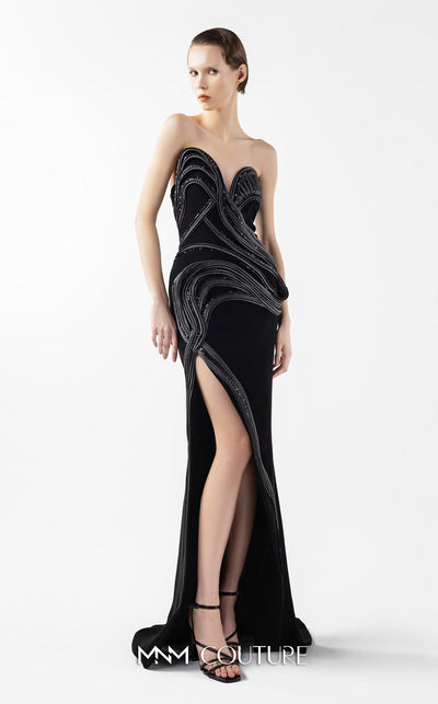 MNM Couture Style G2048 showcasing a strapless asymmetrical black crepe gown with anthracite lamé organza waves, crystal embellishments, and a dramatic thigh-high slit | Couture Shop LA