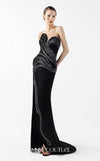 MNM Couture Style G2048 showcasing a strapless asymmetrical black crepe gown with anthracite lamé organza waves, crystal embellishments, and a dramatic thigh-high slit | Couture Shop LA